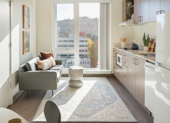 A modern kitchen with a view of the city.