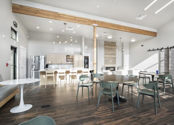 a dining room and kitchen with a table and chairs