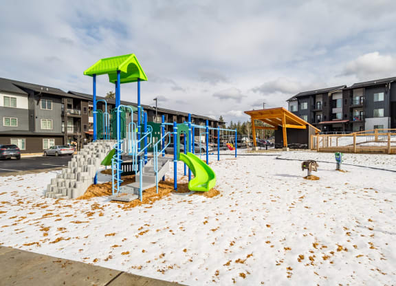 the playground at the flats at big tex apartments