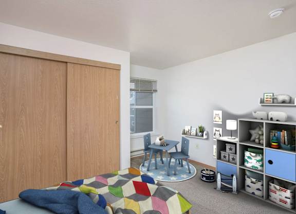 A room with a bed, a chair, and a bookshelf.