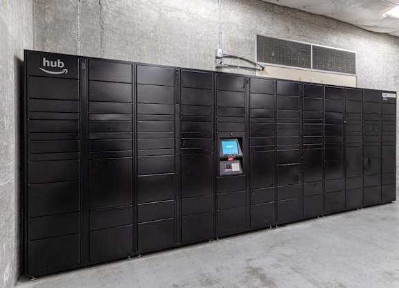 A row of black lockers with a sign that says hub on the top left.