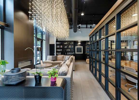 A modern living room with a black and white color scheme.