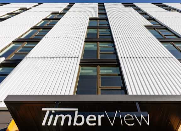 A tall building with the name TimberView on the front.