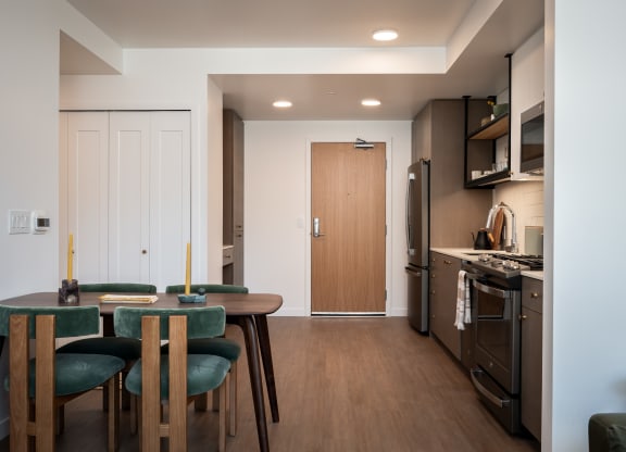 a kitchen and dining room with a table and chairs at Slabtown Square Apartments, Portland 
