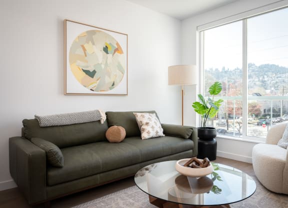 a living room with a couch and a coffee table at Slabtown Square Apartments, Oregon, 97209