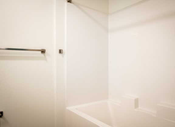 a small bathroom with a shower and a sink