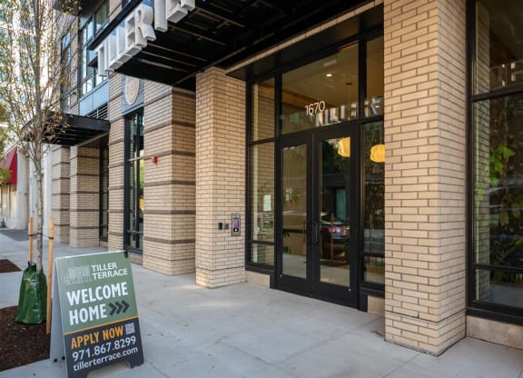 a building with a welcome home sign in front of it