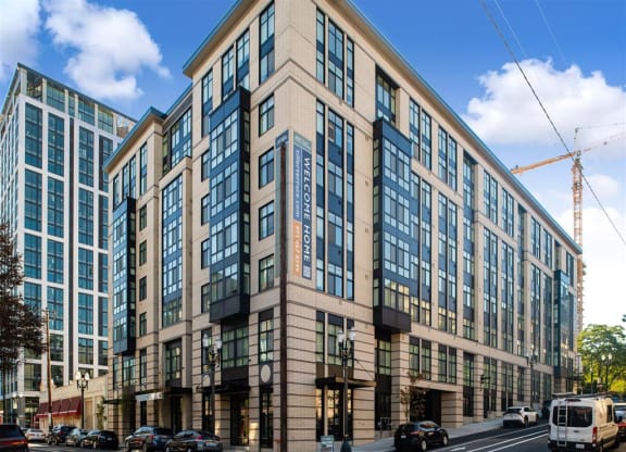 a large building on the corner of a city street