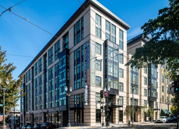 a large building on the corner of a city street