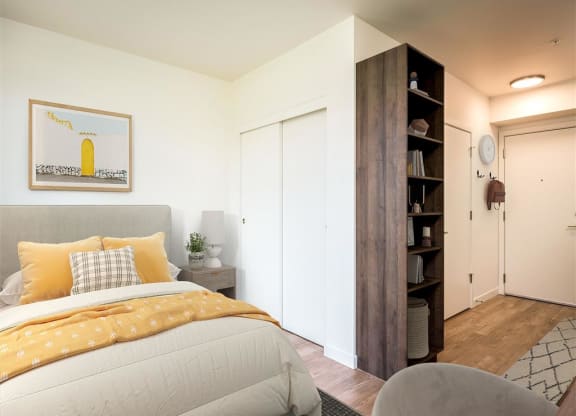 a bedroom with a bed and a closet