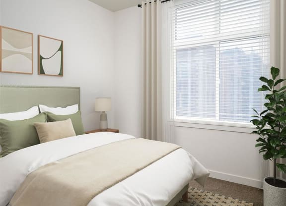 a bedroom with a bed and a large window