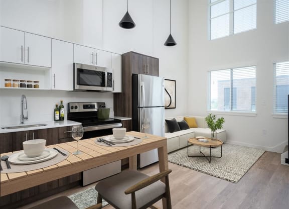 a kitchen and living room in an apartment