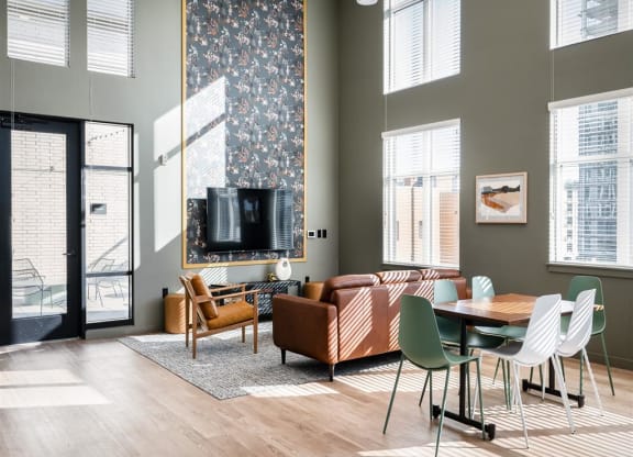 a living room with a couch and a table and a tv