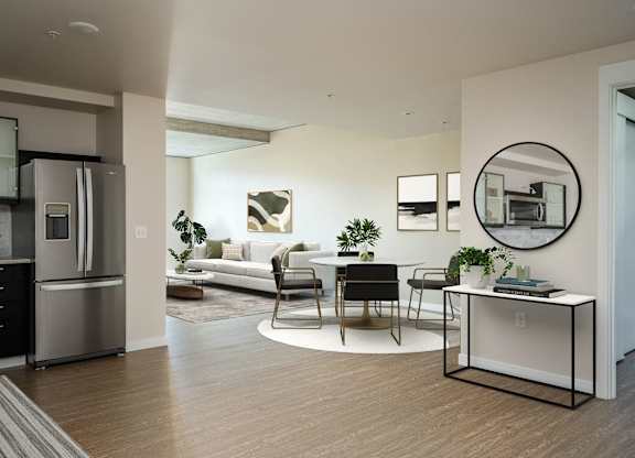 a living room with a kitchen and a dining room