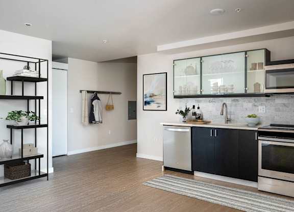 a kitchen with a sink and a stove and a window