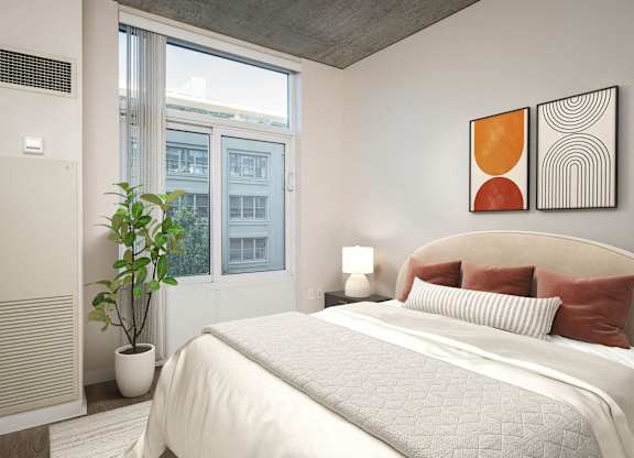 a white bedroom with a bed and a window