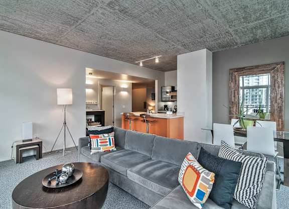 a living room with a gray couch and a coffee table