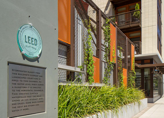 A sign on a building reads LEED 2012.