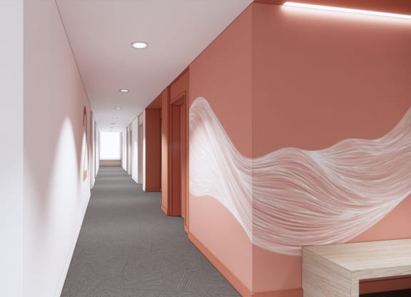 a hallway with pink and white walls with a wave pattern on the wall and a