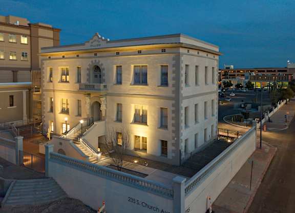 A large white building with the number 235 on the bottom right.