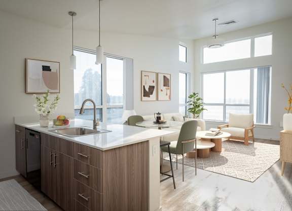 A modern kitchen with a dining table and chairs.