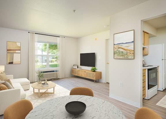 A modern living room with a white couch, a coffee table, and a television.