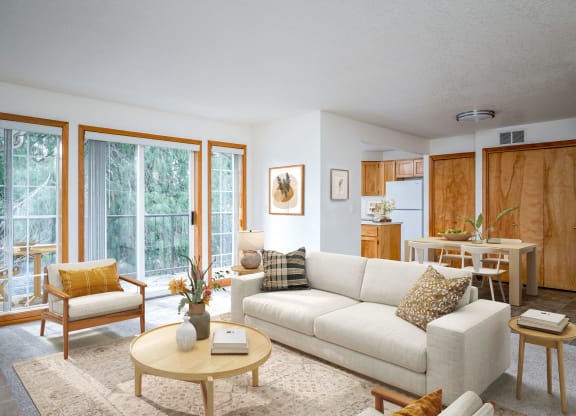 a living room filled with furniture and a large window