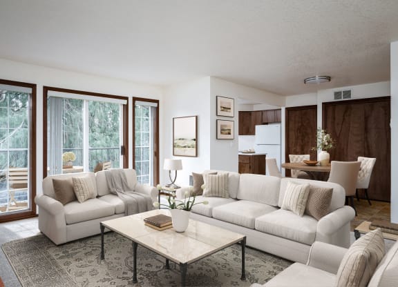 a living room filled with furniture and a large window