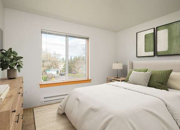 A bedroom with a large bed and a window overlooking a street.