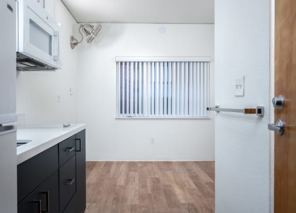 a kitchen and dining area in a 555 waverly unit