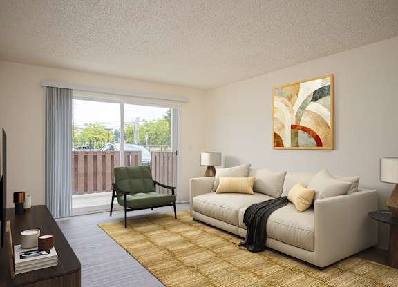A living room with a couch, chair, and a painting on the wall.