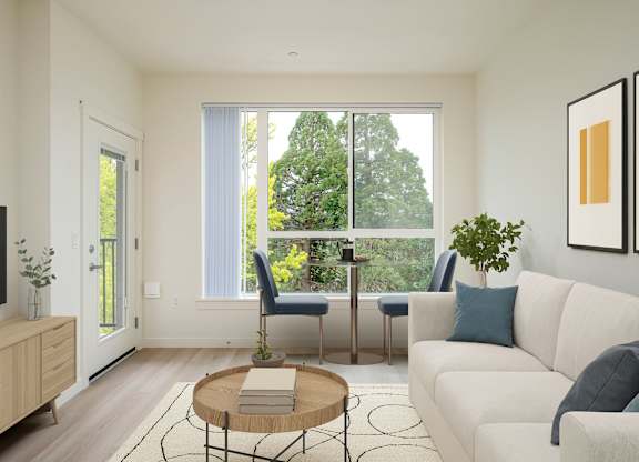 A living room with a white couch, a wooden coffee table, and a flat-screen TV.
