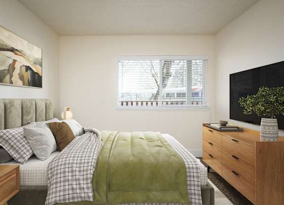 A bedroom with a bed, nightstand, and a painting on the wall.