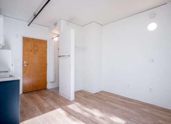 a kitchen and living room in a small apartment