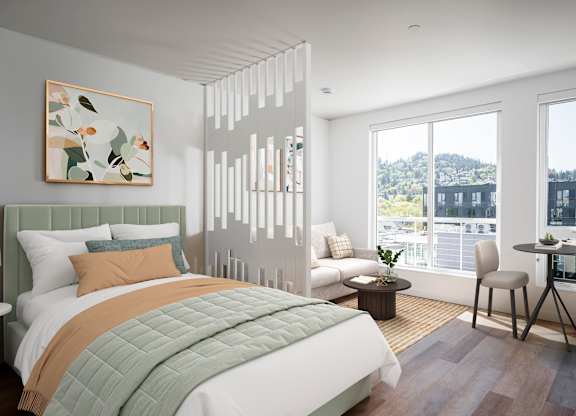 A bedroom with a large bed and a view of the city.