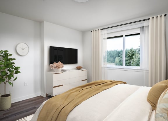 a bedroom with a bed and a large window