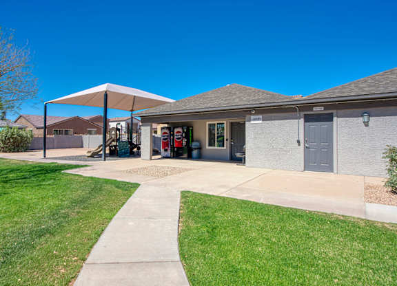 A building with a covered walkway in front of it.