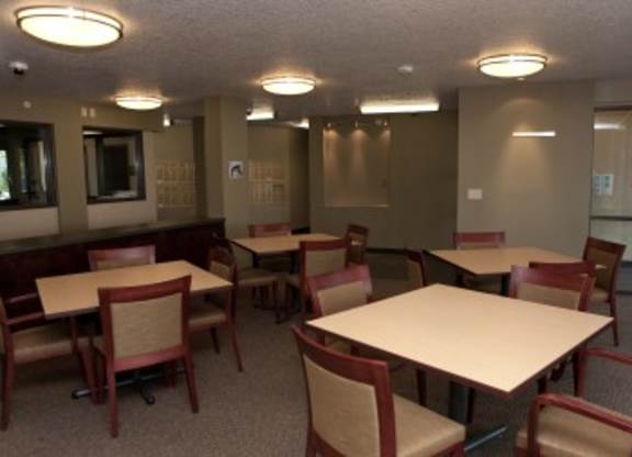 A room with tables and chairs.