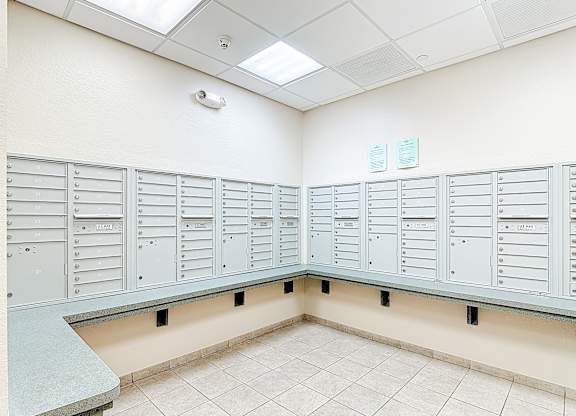 A row of metal lockers in a room.