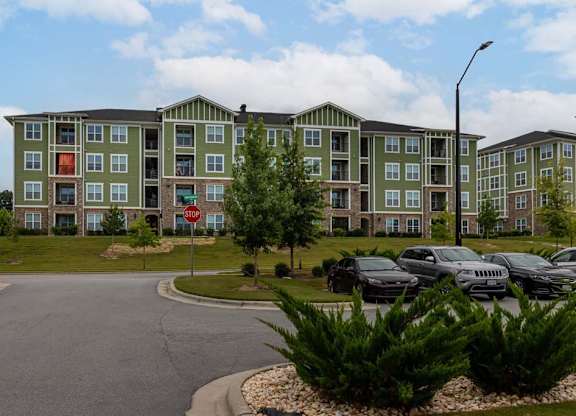 A large apartment complex with a parking lot in front at Foxwood Apartments, Raleigh-Durham, North Carolina