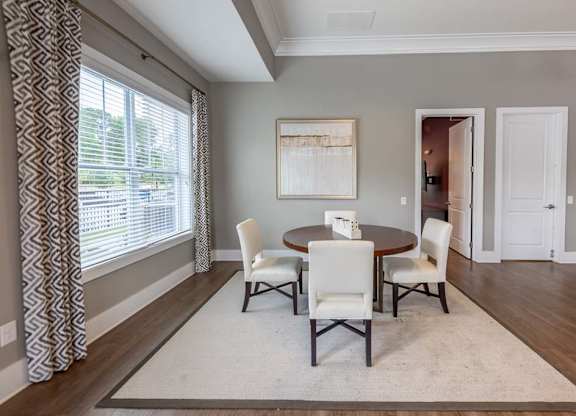 A dining room with a table and chairs at Foxwood Apartments, Raleigh-Durham, NC