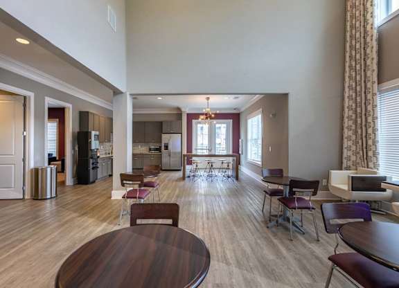 A large open living room with a dining table and chairs at Foxwood Apartments, North Carolina, 27616