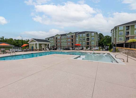 A large swimming pool surrounded by apartment buildings at Foxwood Apartments, Raleigh-Durham