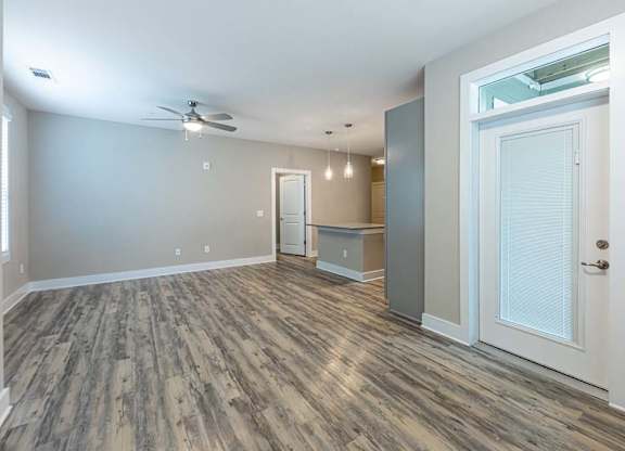 A room with a ceiling fan and wood flooring at Foxwood Apartments, Raleigh-Durham, NC, 27616