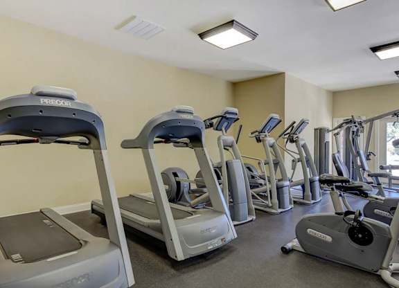 A gym with treadmills and elliptical machines at Ethan Pointe Apartments, Greensboro