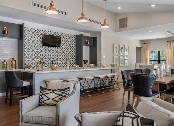 A modern living room with a grey and white color scheme.
