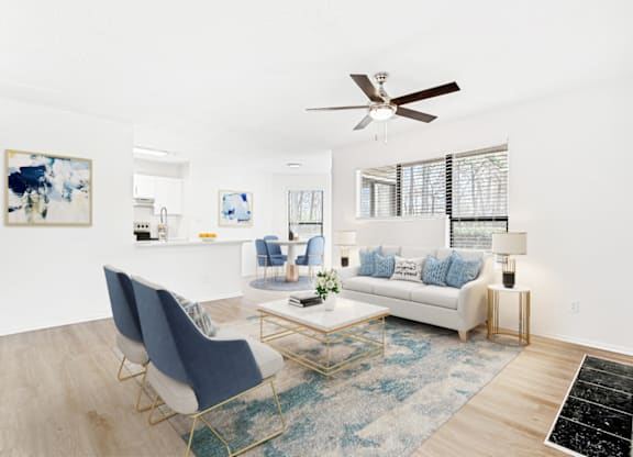 Living Room With Ceiling Fan at Bridges at Mallard Creek Apartment Homes, North Carolina
