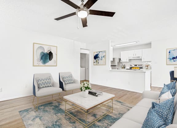 a living room with two couches and a coffee table at Bridges at Mallard Creek Apartment Homes, Charlotte, 28269
