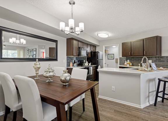 kitchen and dining room with hardwood-style flooring