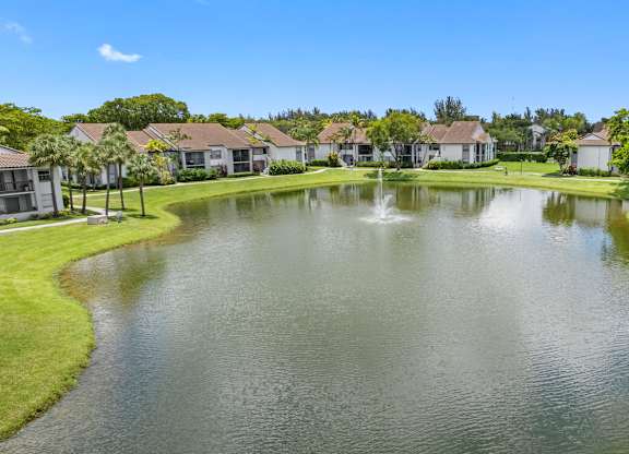 apartment community with a lake in the center